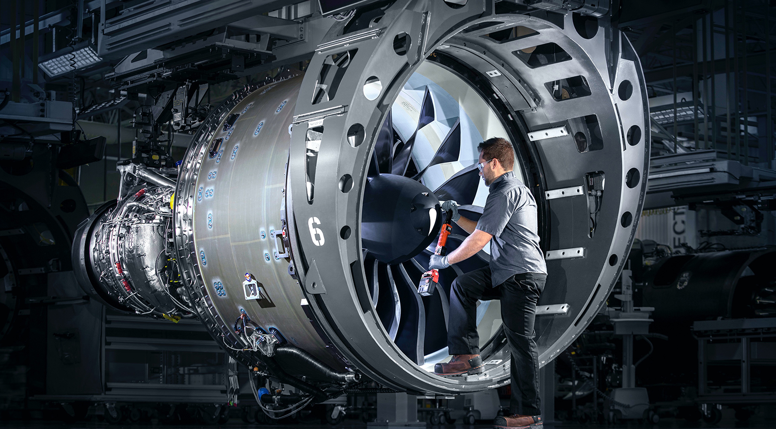 A worker inside an engine while helping to build it